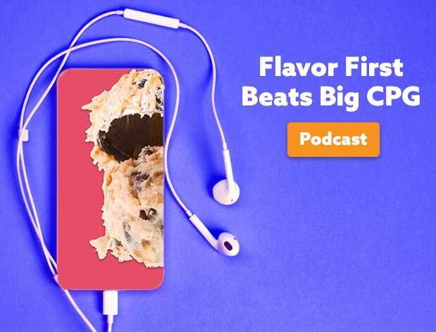 Scoop of edible cookie dough on grapefruit colored background text overlay 