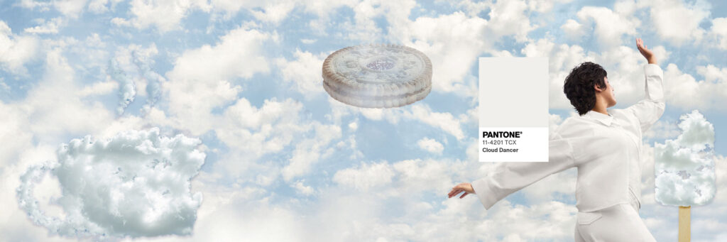 Cloud background showcasing Pantone's color of the year 2026 "cloud dancer" with food items made from clouds and a Pantone swatch