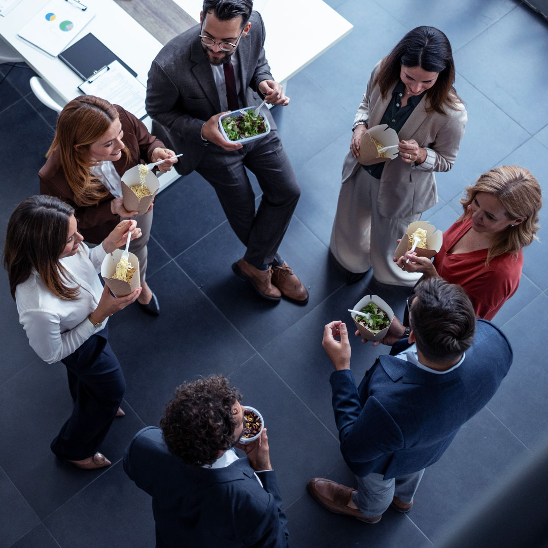 Group or team meeting, talking over food, startup culture