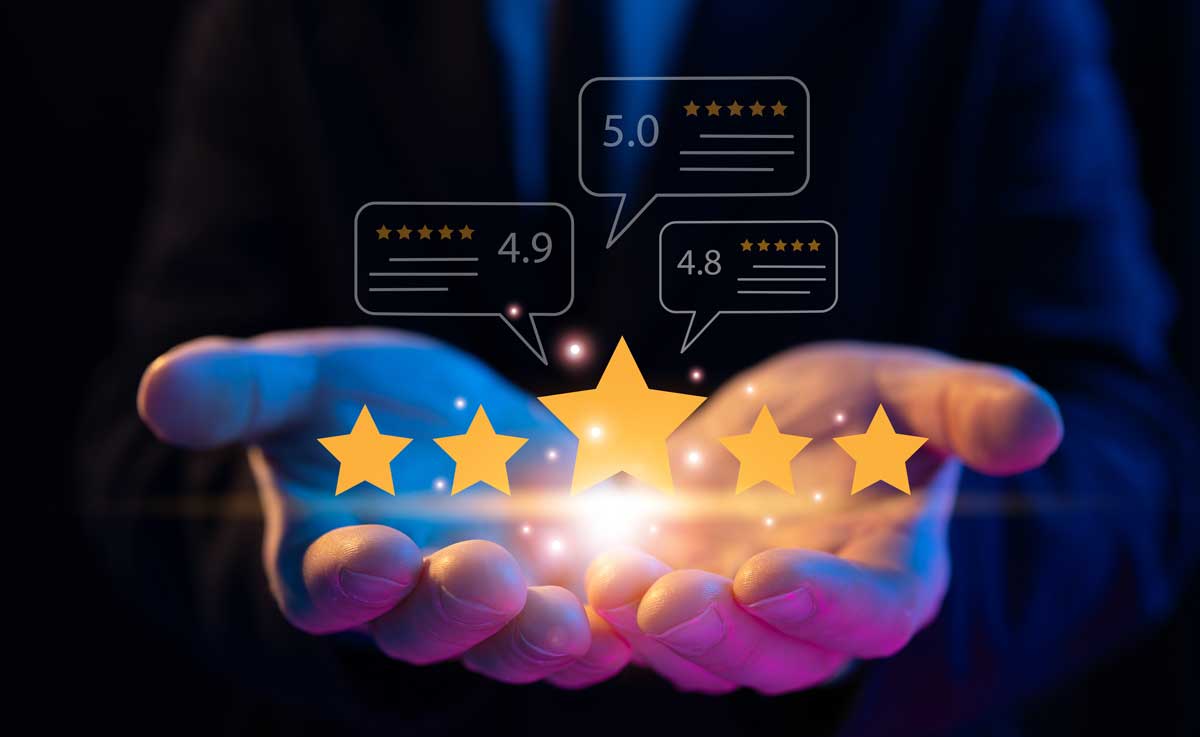 Male hands holding 5 stars, multiple positive reviews for TraceGains customer success team